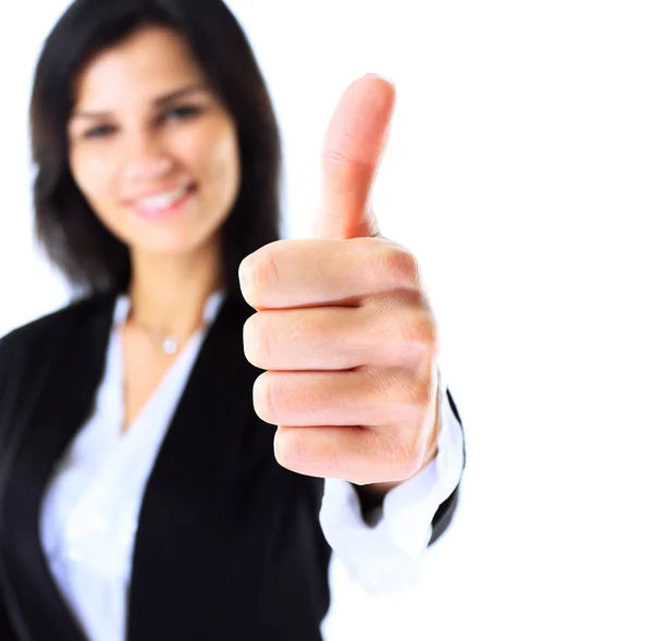 Bonita mulher de negócios sorridente em pé contra fundo branco. Polegar para cima . — Fotografia de Stock