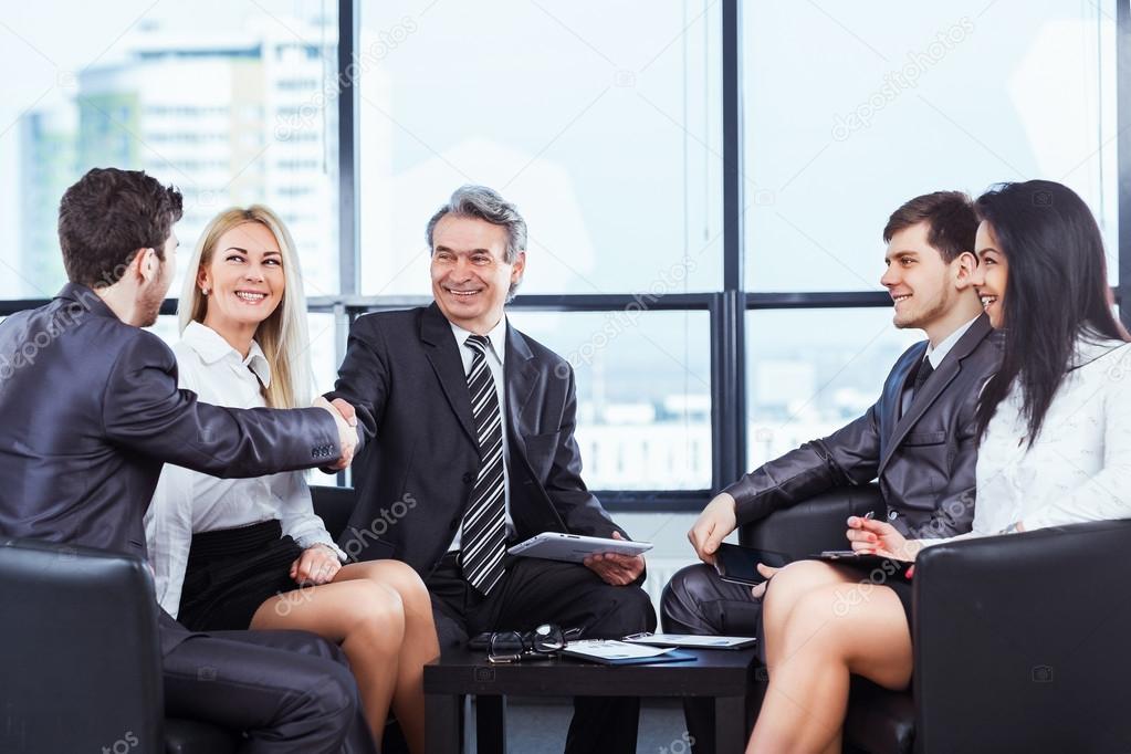 business team with tablet pc computers, documents having discussion in office