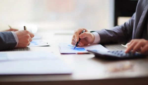 Two business people working sitting at the table. Close up of hands — Stock Photo, Image