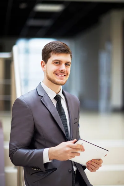 Young businessman with a tablet pc, at the office — Stock Photo, Image