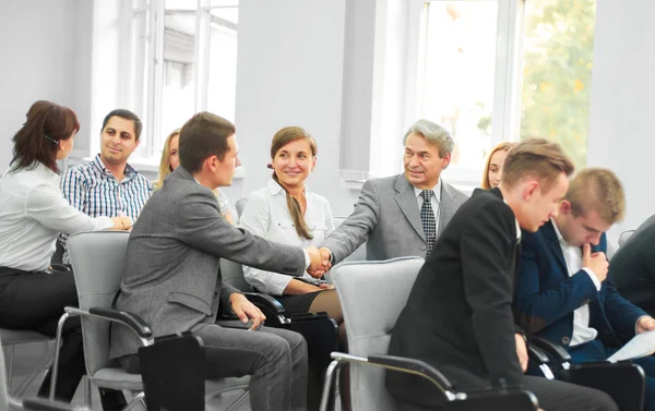 Business partners shake hands in the conference room — Stock Image Business partners shake hands in the conference room Royalty Free Stock Photos