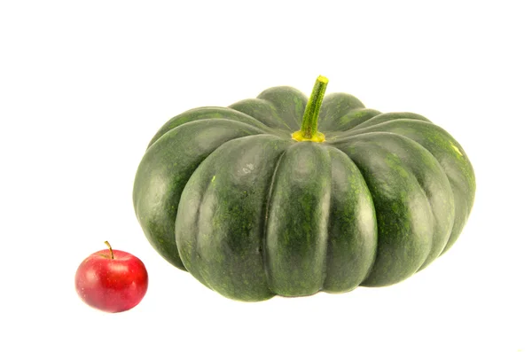 Big green pumpkin and small red apple isolated — Stock Photo, Image