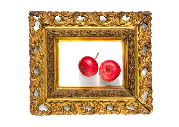 Two red apple in ancient antique golden picture frame — Stock Photo, Image