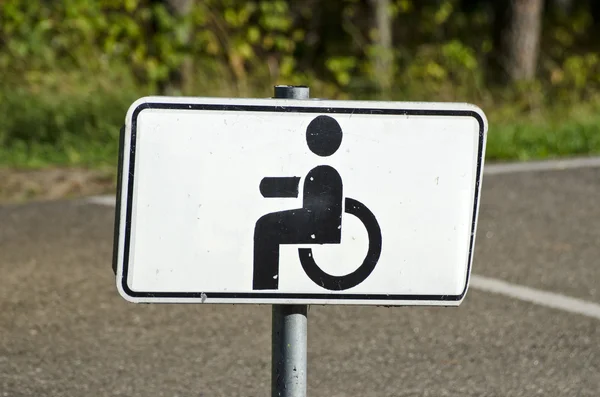 Wheelchair Handicap Sign in resort park  road — Stock Photo, Image