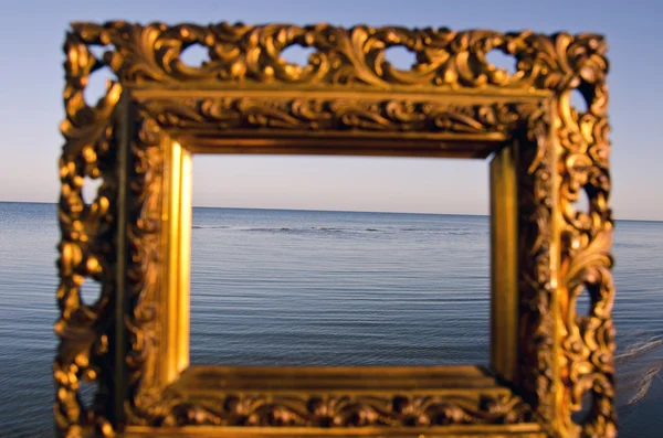 Vintage golden picture frame and sea landscape — Stock Photo, Image