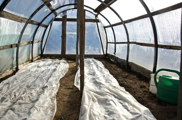 Greenhouse hothouse in early spring after vegetable seeding — Stock Photo, Image