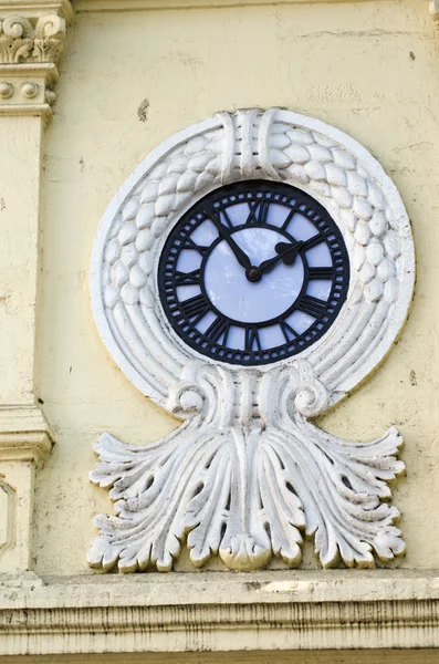 Beautiful decorative clock on asia city  house wall — Stock Photo, Image