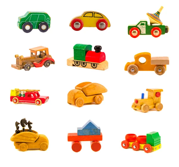 Coleção de brinquedos de caminhão de carro de madeira velho isolado no branco — Fotografia de Stock