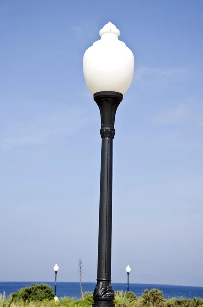 Aegean sea beach park lamps in Rhodes, Greece — Stockfoto