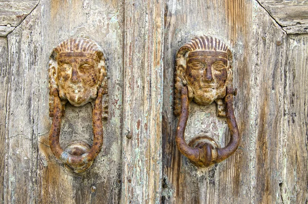 Antique door knockers in Greek island — Stock Photo, Image