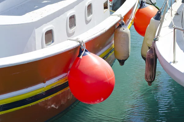 Two boats with orange and white buoys — Stock Photo, Image