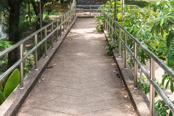 Modern walkway bridge with metal railing. — Stock Photo, Image