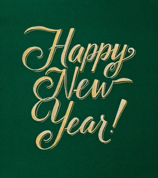 Šťastný nový rok přání zlatý nápis na zeleném pozadí — Stock fotografie