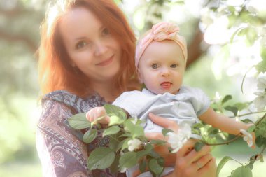 Mom is always close up. Mother and daughter in nature.