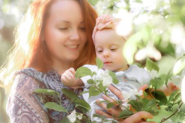 Mom is always close up. Mother and daughter in nature.
