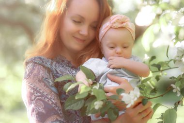 Mom is always close up. Mother and daughter in nature.