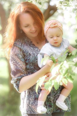 Mom is always close up. Mother and daughter in nature.