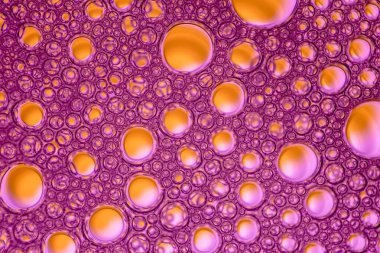 Orange bubles on purple background