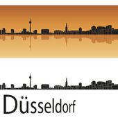 Düsseldorfer Skyline vor orangefarbenem Hintergrund