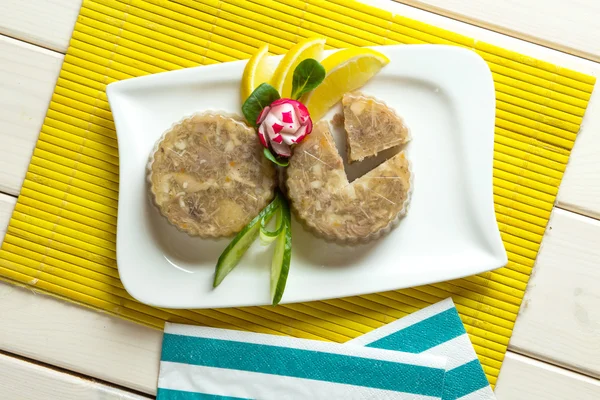 Pork jelly on white plate — Stock Photo, Image