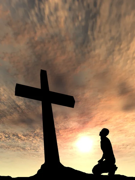 Conceito conceitual preto cruz ou religião símbolo homem silhueta em rochas sobre um céu por do sol com nuvens de luz solar fundo — Fotografia de Stock