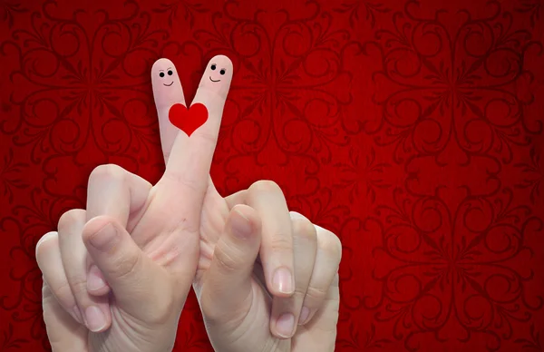 Hands with fingers and a heart painted — Stock Photo, Image