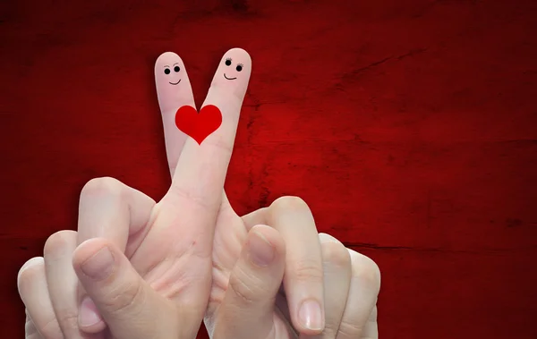 Fingers and a heart painted — Stock Photo, Image