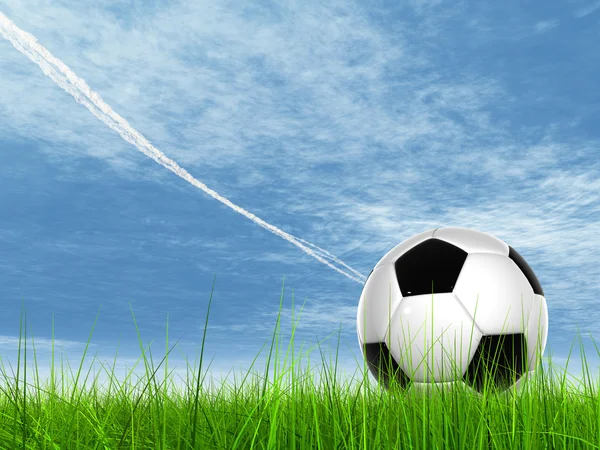 Ballon de football dans l'herbe de champ frais — Photo