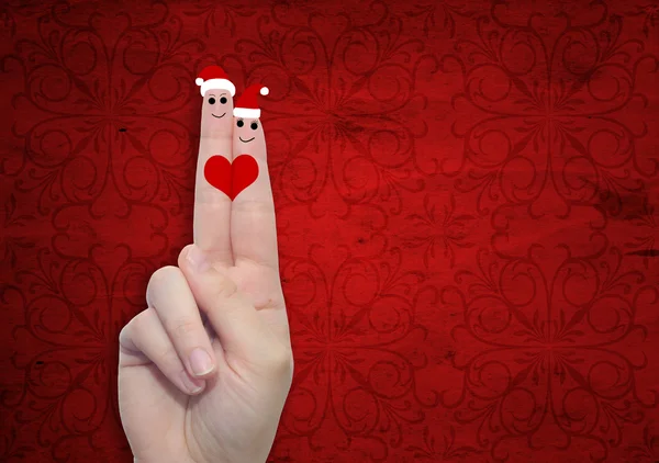 Finger verliebt in Weihnachtsmützen — Stockfoto