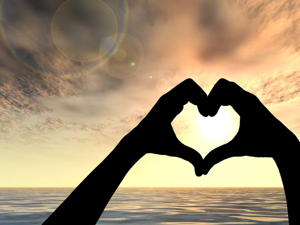 Heart shape made of hands  silhouettes over a sky and sea or water at sunset background — Stock Photo, Image