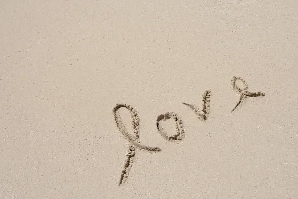 Love  in sand on a beach — Stock Photo, Image