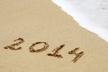 kum üzerinde el yazısı metin 