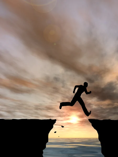Businessman silhouette jumping from cliff — Stock Photo, Image