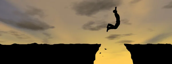 Businessman silhouette jumping from cliff — Stock Photo, Image