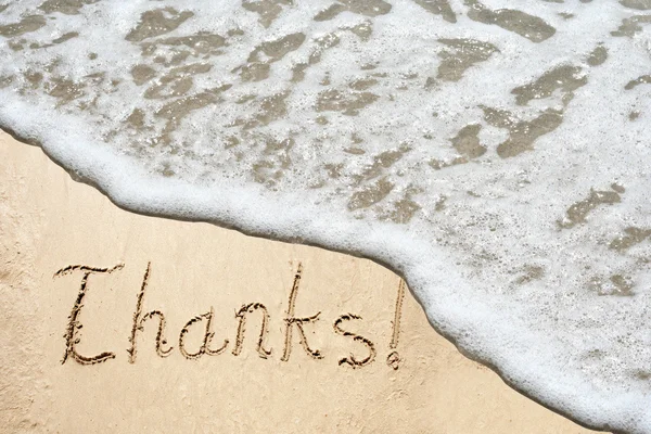 Thanks text carved in a golden sand — Stock Photo, Image