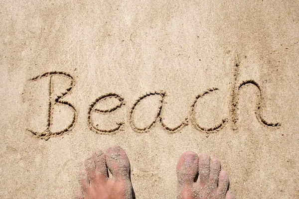 Text handgeschrieben auf Sand — Stockfoto