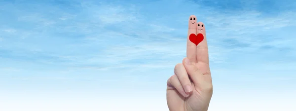 fingers with smiley faces  and   heart