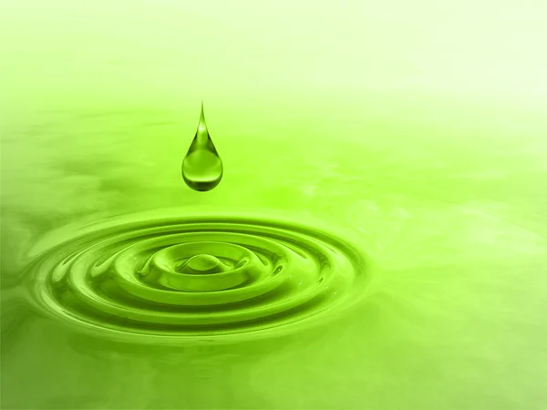 緑の液滴が水に落ちる — ストック写真