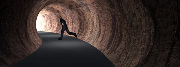 Hombre de negocios en túnel de camino oscuro — Foto de Stock