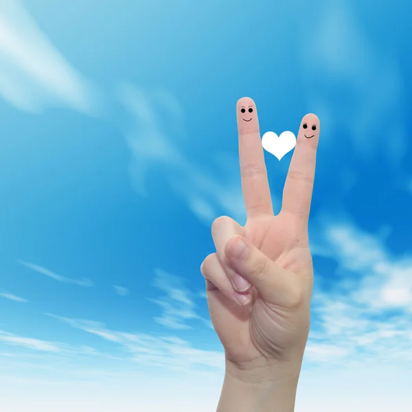 fingers  with smiley faces and heart