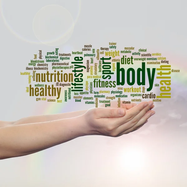 Gezondheid word cloud in handen — Stockfoto