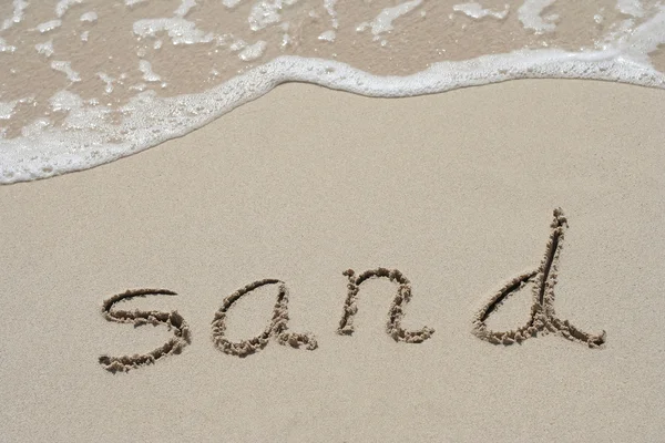 Texte manuscrit dans le sable — Photo