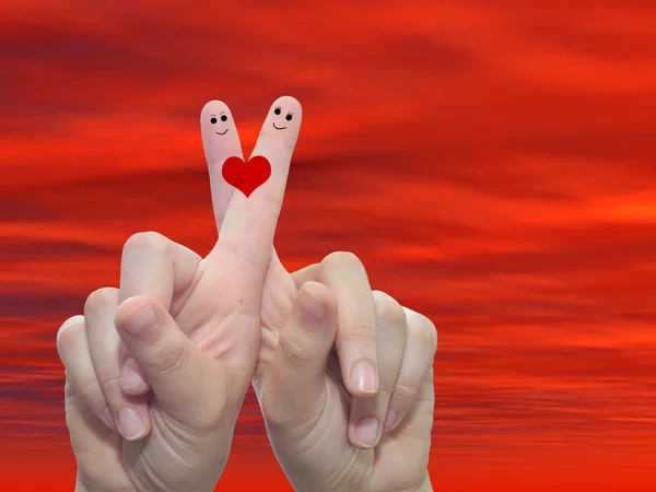 Fingers painted with a red heart — Stock Photo, Image