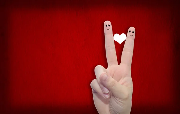 Fingers and a heart painted — Stock Photo, Image
