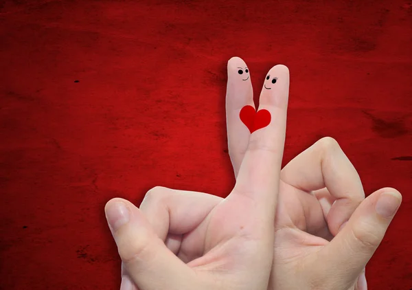 Parmak ve bir kalp ile iki el boyalı — Stok fotoğraf