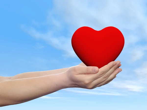 Red glass heart sign or symbol held in hands by a woman — Stock Photo, Image