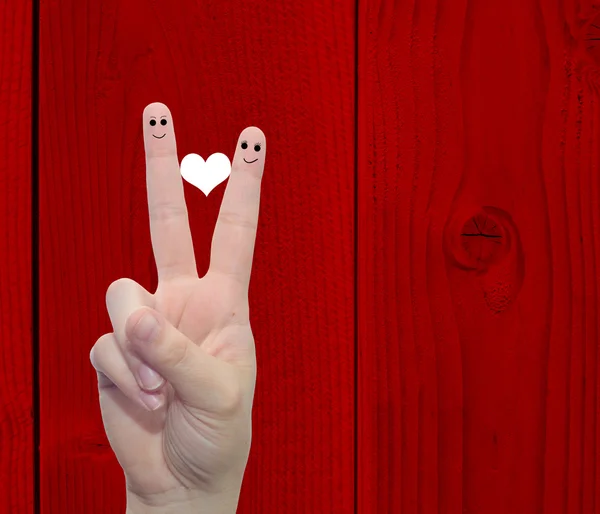 Due dita della mano con un cuore dipinto — Foto Stock