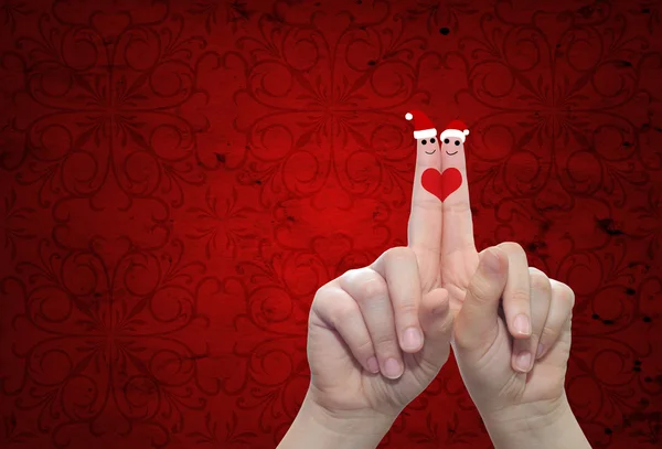 Finger verliebt in Weihnachtsmützen — Stockfoto