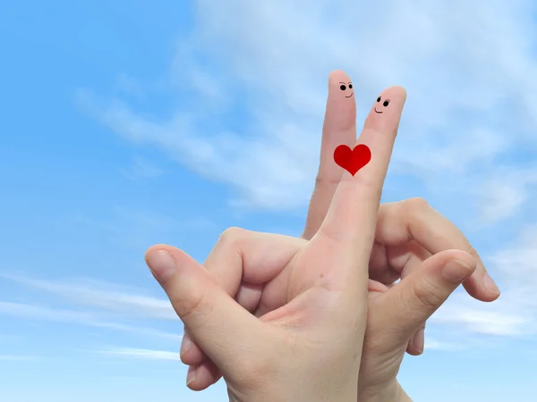 Fingers painted with a red heart — Stock Photo, Image