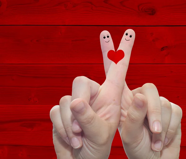 Hands fingers with a heart painted — Stockfoto